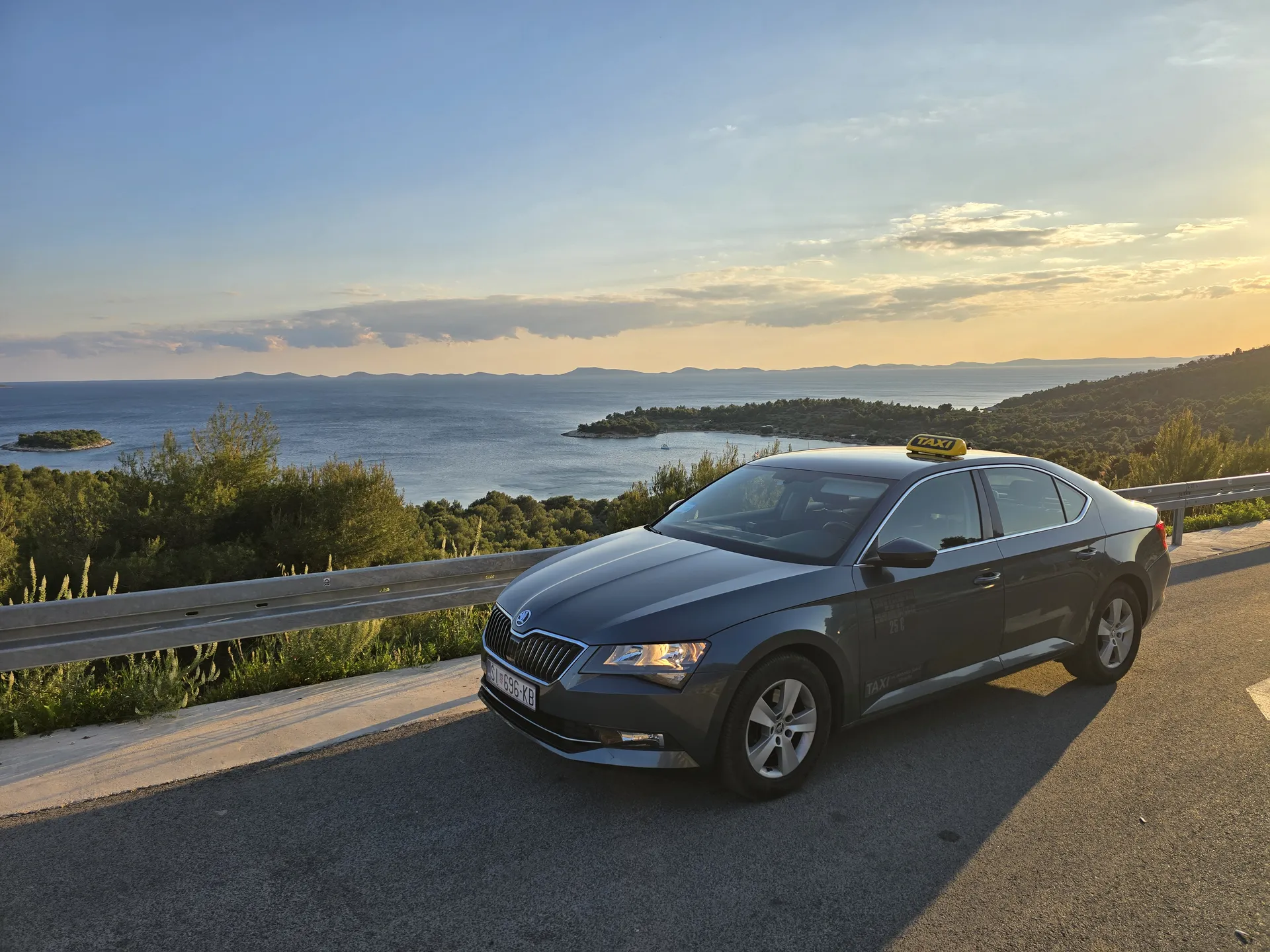 TAXI Antonio's Škoda Superb on the open Dalmatian coast road between Šibenik and Split